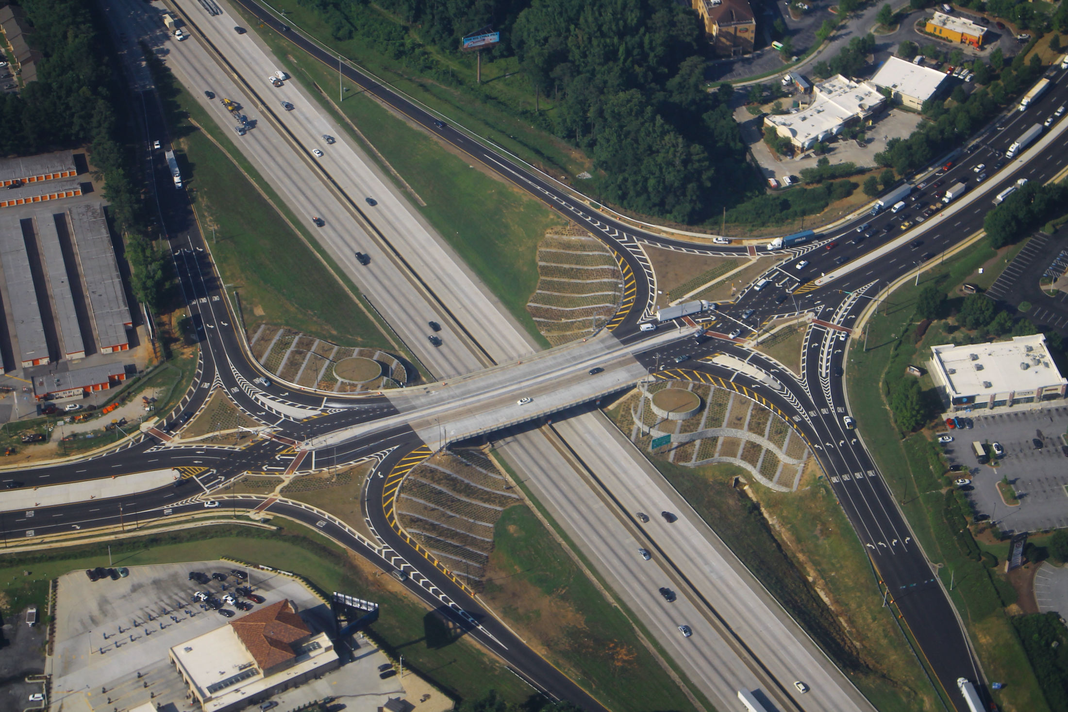 Aerial view of the Camp Creek Parkway interchange on Interstate 285 in Atlanta, with trucks in traffic